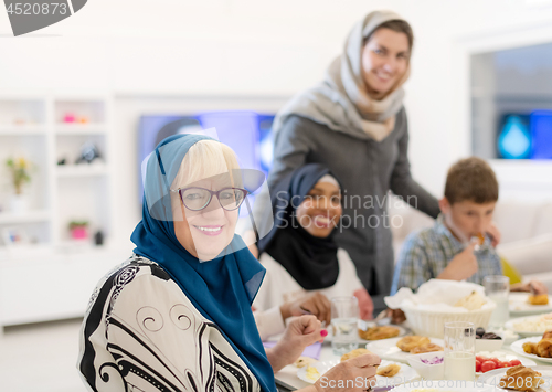 Image of modern multiethnic muslim family having a Ramadan feast