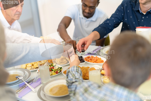 Image of modern multiethnic muslim family having a Ramadan feast