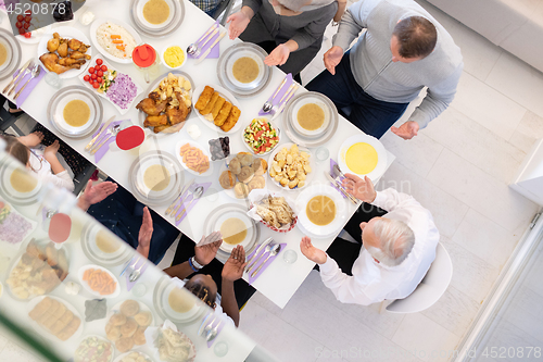 Image of top view of modern muslim family having a Ramadan feast