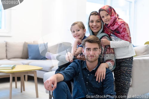 Image of portrait of young happy modern muslim family