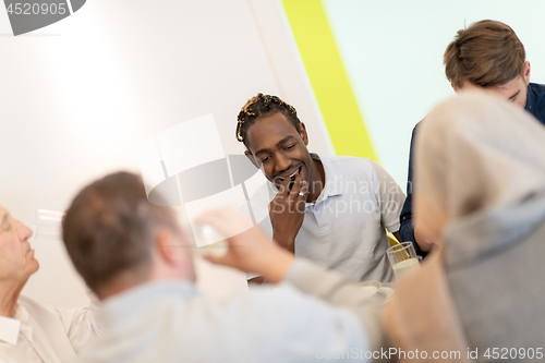 Image of black man enjoying iftar dinner with family