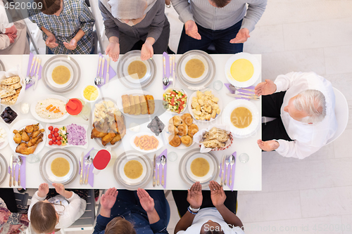 Image of top view of modern muslim family having a Ramadan feast