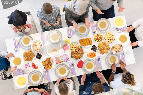 Image of top view of modern muslim family having a Ramadan feast