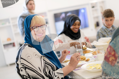 Image of modern multiethnic muslim family having a Ramadan feast