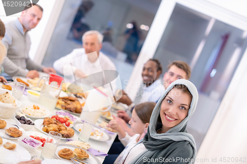 Image of modern multiethnic muslim family having a Ramadan feast