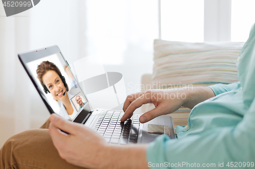 Image of man having video call with helpline operator