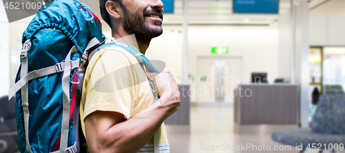 Image of man with backpack over airport terminal