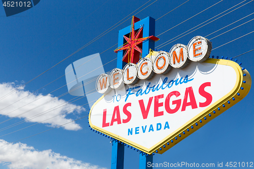 Image of welcome to fabulous las vegas sign over blue sky