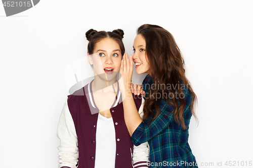 Image of teenage girls gossiping or sharing secrets