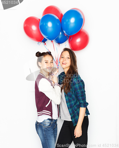 Image of happy teenage girls with helium balloons