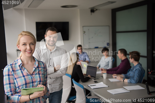 Image of Business People Working With Tablet in startup office