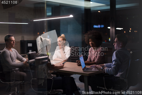 Image of Multiethnic startup business team in night office