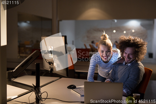 Image of young designers in the night office