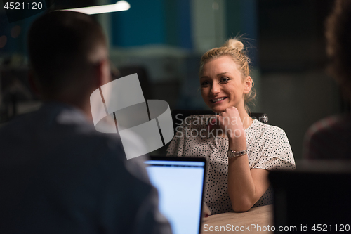 Image of Multiethnic startup business team in night office