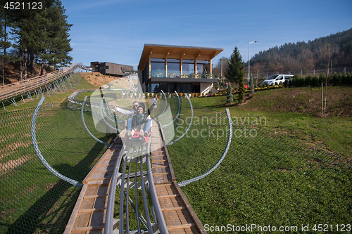 Image of couple enjoys driving on alpine coaster