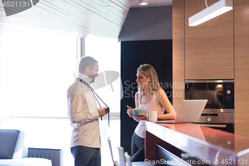 Image of A young couple is preparing for a job and using a laptop