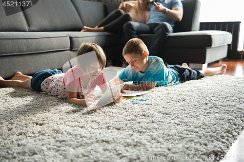 Image of young couple spending time with kids