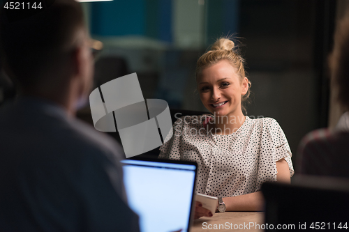 Image of Multiethnic startup business team in night office