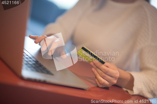 Image of woman  shopping  Online