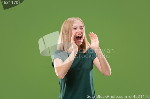 Image of A portrait of surprised screaming woman