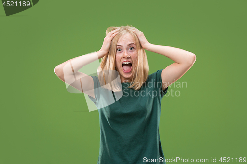 Image of A portrait of surprised screaming woman