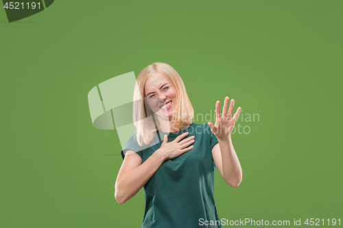 Image of happy woman. image of female model on green