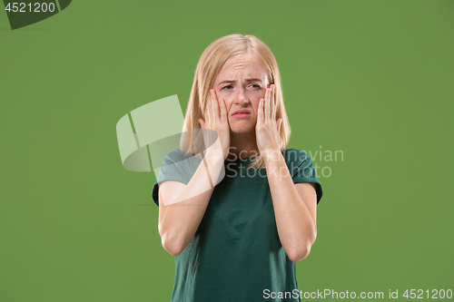 Image of Beautiful woman looking sad and bewildered