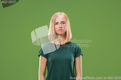 Image of Beautiful woman looking sad and bewildered