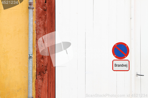 Image of Wall detail with parking forbidden sign