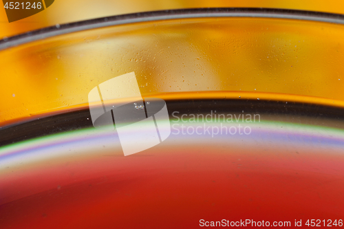 Image of Detail of a glass with red wine and bubbles
