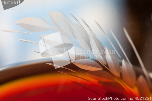 Image of Detail of a glass with red wine and bubbles