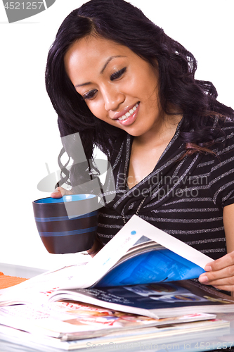 Image of Beautiful Woman Reading a Magazine