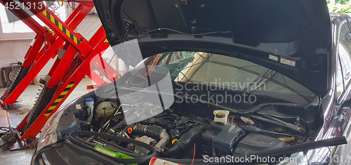 Image of Car service repair inside garage