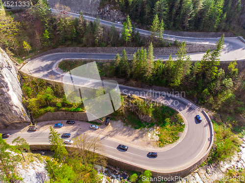 Image of Aerial view of curvy forest road