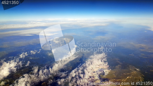 Image of Clouds and land below