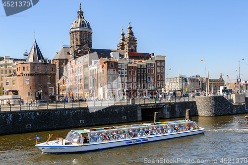 Image of Sightseeng at Canal Boats near the Central Station of Amsterdam