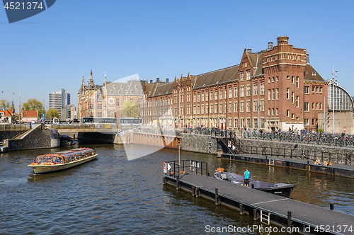 Image of Sightseeng at Canal Boats near the Central Station of Amsterdam