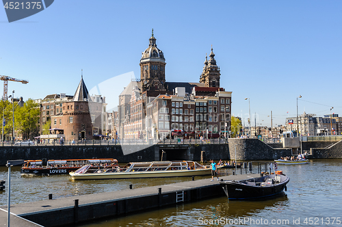 Image of Sightseeng at Canal Boats near the Central Station of Amsterdam