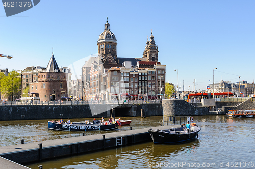 Image of Sightseeng at Canal Boats near the Central Station of Amsterdam