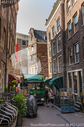 Image of People at streets of Amsterdam during spring time