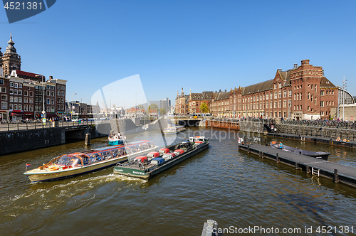 Image of Sightseeng at Canal Boats near the Central Station of Amsterdam