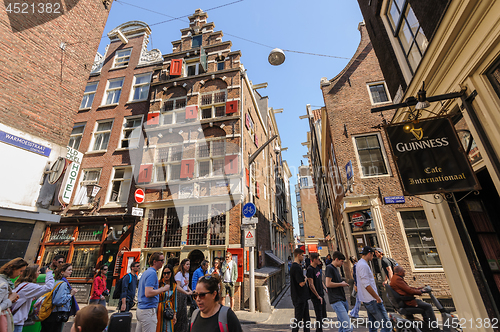 Image of People at streets of Amsterdam during spring time