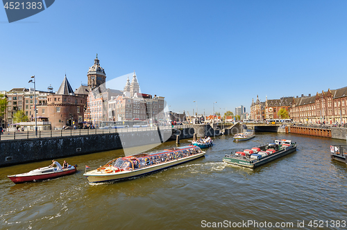 Image of Sightseeng at Canal Boats near the Central Station of Amsterdam