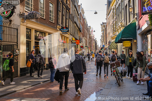 Image of People at streets of Amsterdam during spring time