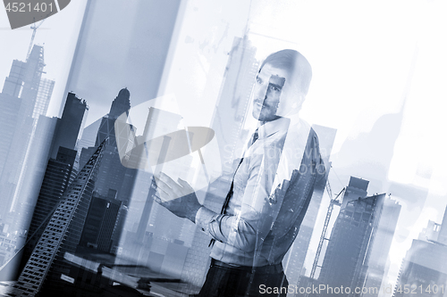 Image of Business presentation on corporate meeting against new york city window reflections.