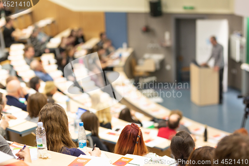 Image of Expert speaker giving a talk at scientific business conference event.