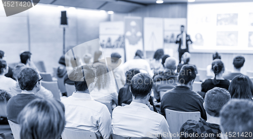 Image of Business speaker giving a talk at business conference event.