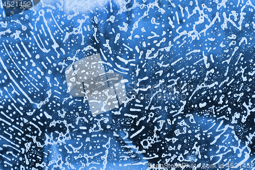 Image of Soap foam on glass