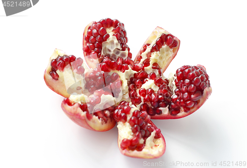 Image of Tasty cut pomegranate fruit on white background