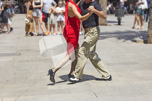 Image of Street couple dancers performing Argentine tango dance